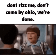 a boy is talking to another boy in a movie and they are talking about ohio .