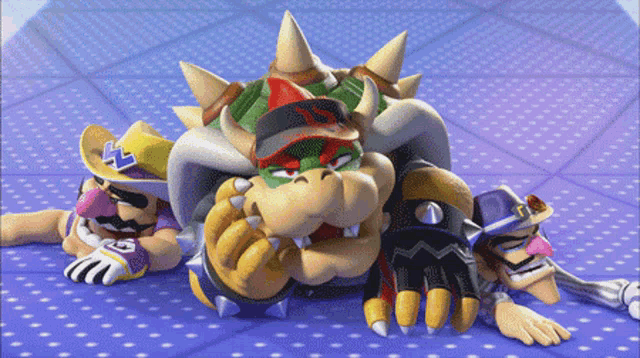 bowser and wario are laying on a purple carpet