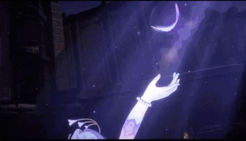 a woman is holding a purple feather in her hand in a dark room .
