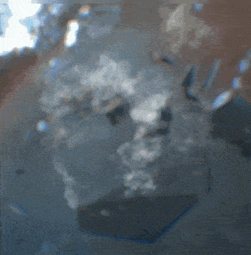 a blurred image of a body of water with a blue background