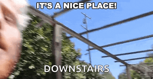 a man says it 's a nice place downstairs in front of a fence .