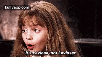 a close up of a woman 's face with her mouth open and the words `` it 's leviosa , not leviosar ''