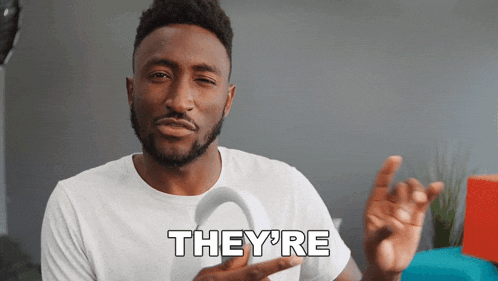 a man in a white shirt with the word they 're written on it