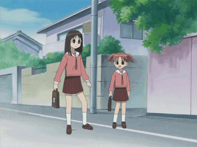 two girls are walking down a street and one of them is carrying a briefcase that says ' a ' on it