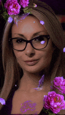 a woman wearing glasses with purple flowers on her head