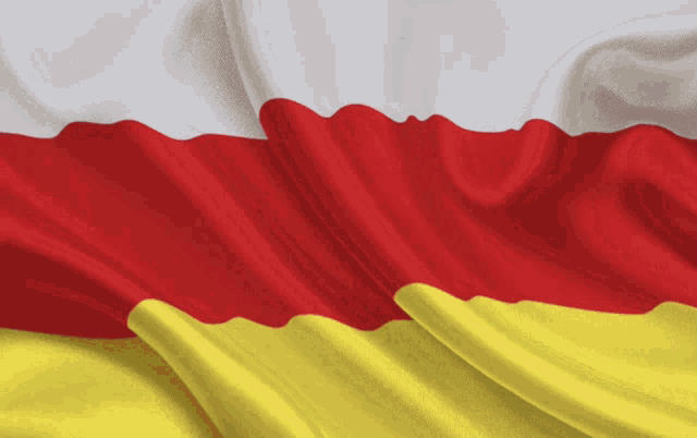 a red white and yellow flag with a white background