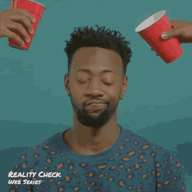 a reality check web series poster with a man pouring liquid into his face