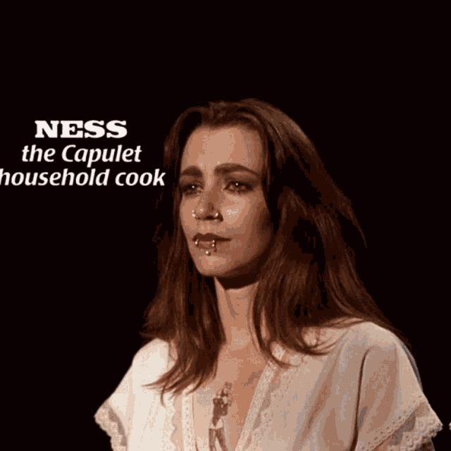 a woman with a tattoo on her chest and the words ness the capulet a household cook below her