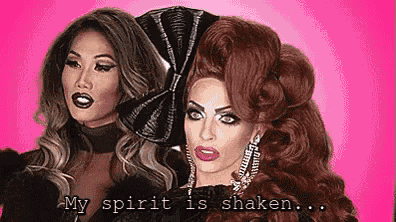 two drag queens are standing next to each other on a pink background with the words `` my spirit is shaken '' written on the bottom