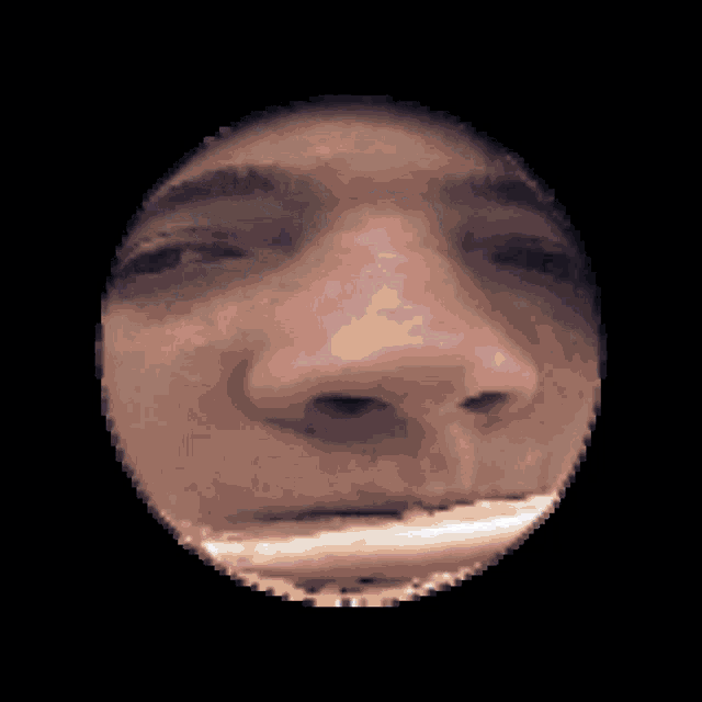 a pixelated image of a man 's face with his mouth open