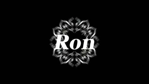 a man with a santa hat on has the word ron in front of his face
