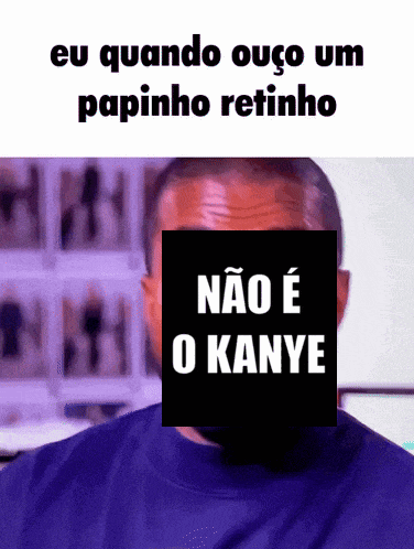 a man in a blue shirt has a sticker on his face that says eu quando ouco um papinho retinho