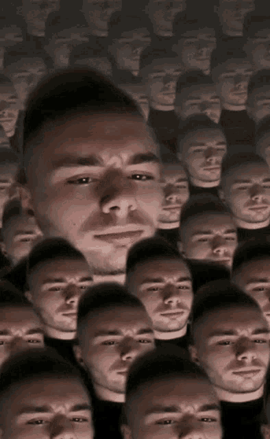 a man 's face is surrounded by many other faces of men