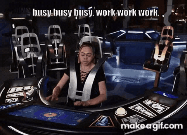a woman sits at a desk with the words busy busy busy work work work on the bottom