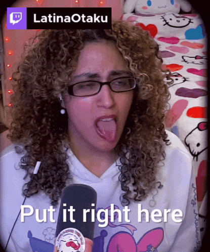 a woman with curly hair sticking out her tongue and the words put it right here