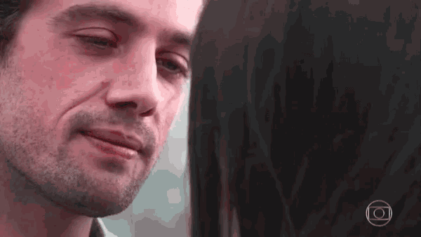 a close up of a man 's face with a circle in the middle