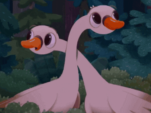 two cartoon ducks are standing next to each other in the grass