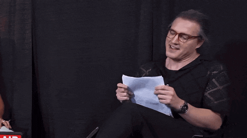 a man holding a piece of paper with the words i haven 't thrust in years