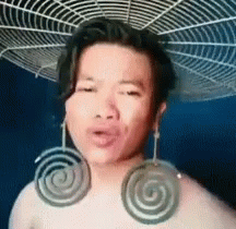 Lelaki Nyanyi Pakai Subang Ubat Nyamuk Lingkar Man Sings Wearing Weird Earrings GIF - Lelaki Nyanyi Pakai Subang Ubat Nyamuk Lingkar Man Sings Wearing Weird Earrings Drag Queen GIFs