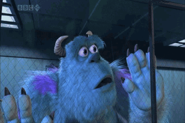 a monster from the movie monsters inc is behind bars