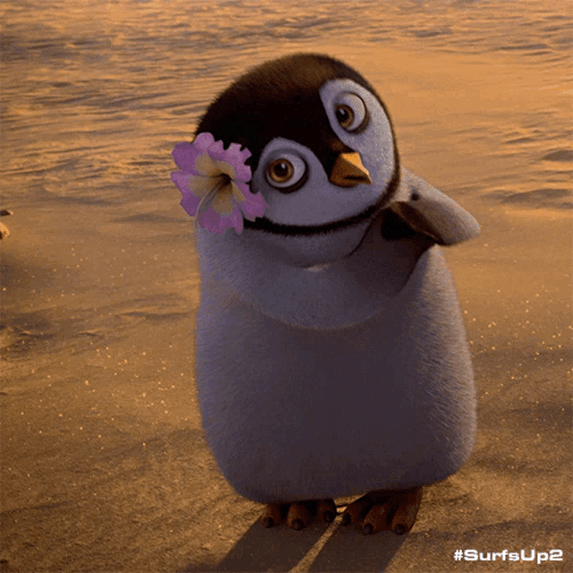 a penguin with a flower in its beak is standing on a sandy beach