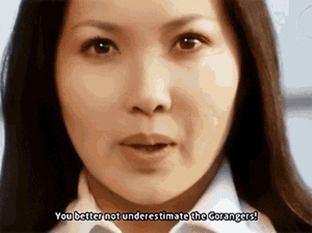 a close up of a woman 's face with the words you better not underestimate the gorangers