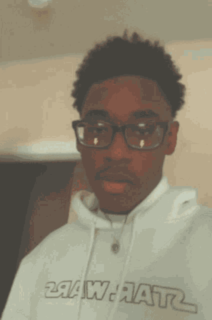 a young man wearing glasses has a lightning bolt on his lens