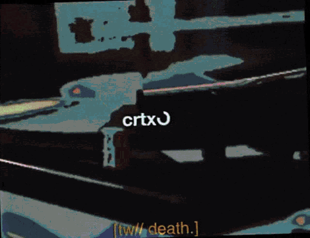 a blurry picture of a window with the words crtxos and tw / death visible