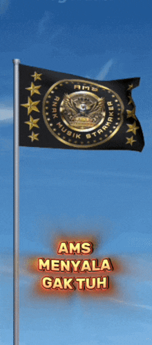 a black and gold ams flag is flying in the blue sky