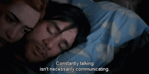 a man and woman laying in bed with the words constantly talking isn t necessarily communicating