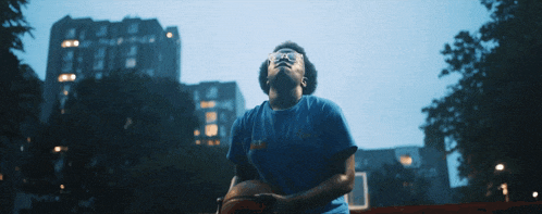 a person wearing a blue shirt that says chicago on it