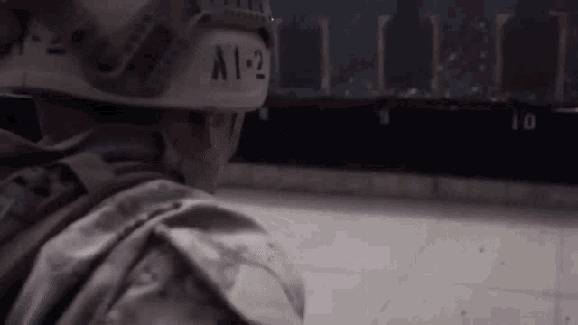 a soldier wearing a helmet with a 1-2 on it