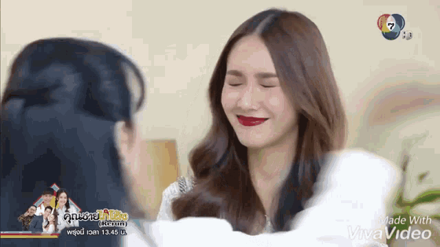 a woman is making a funny face with her eyes closed in a video made with vivavideo