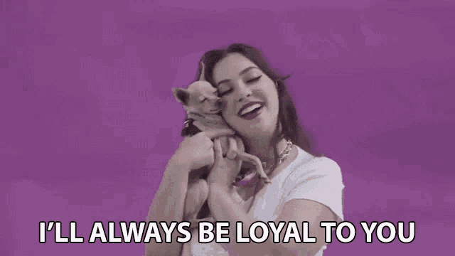 a woman is holding a small dog in her arms and saying `` i 'll always be loyal to you `` .
