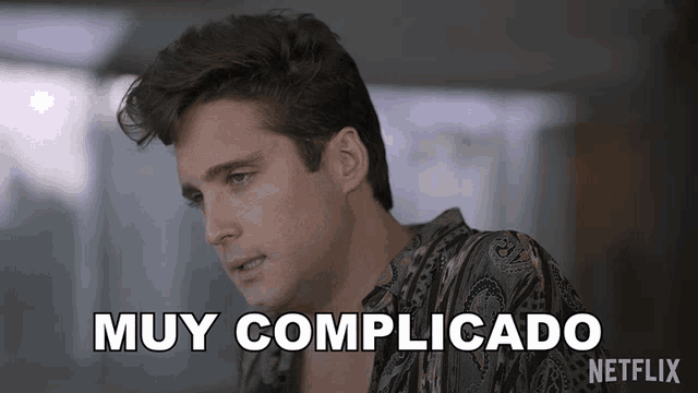 a man in a paisley shirt with the words muy complicado on the bottom