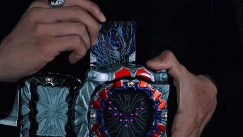 a person is holding a device with a purple screen that says ' x ' on it