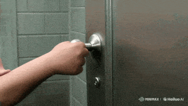 a person 's hand is reaching to open a door with a watermark that says hailuo ai on the bottom