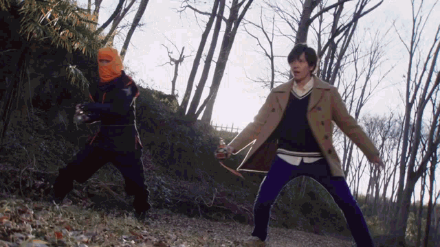 a man in a trench coat stands next to a man in a ninja outfit
