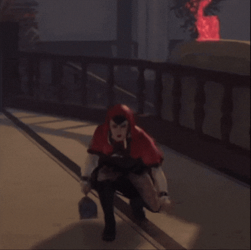 a woman in a red hooded cape is standing on a hallway