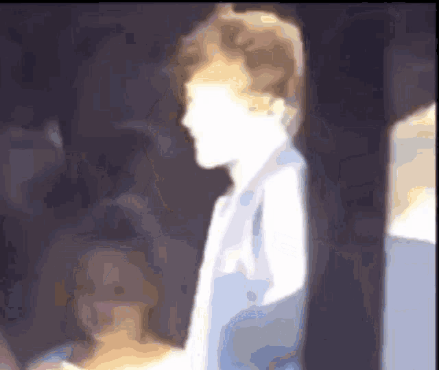a blurry picture of a person 's face with a white background