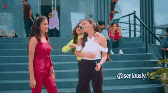 a group of women are standing on a set of stairs with the words @seriously below them