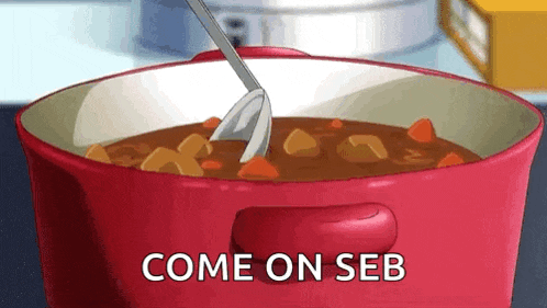 a pot of stew with a spoon in it and the words `` come on seb '' written on it .