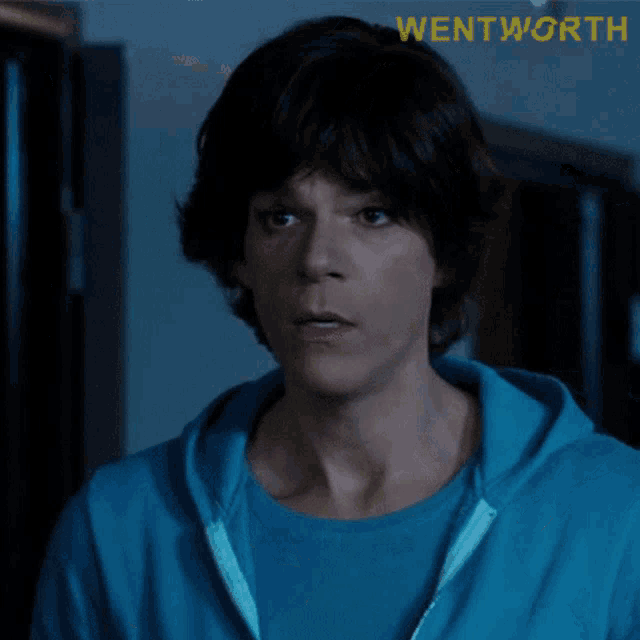 a close up of a person 's face with the word wentworth on the bottom right