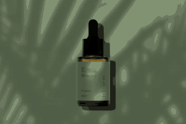 a dropper bottle with a green label that says ' a ' on it