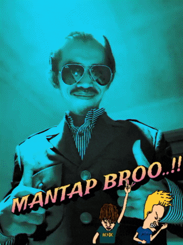 a man in a suit and sunglasses holds up a sign that says mantap broo !!
