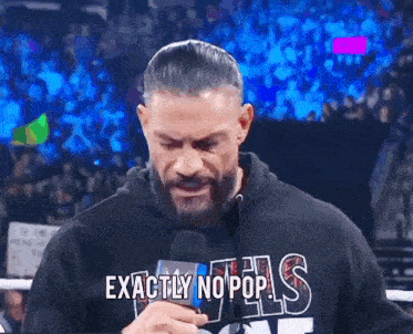 a man with a beard is wearing a hoodie that says exactly no pop
