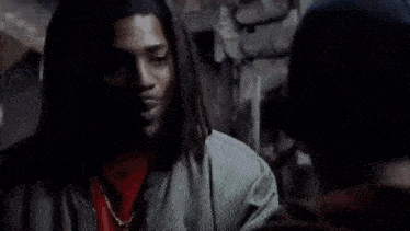 a man with dreadlocks and the word grown man on the bottom right