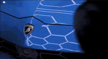 a close up of a blue lamborghini logo