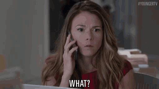 a woman in a red dress is talking on a cell phone and asking what .