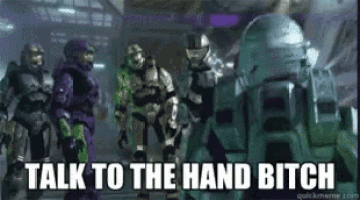 a group of spartan soldiers are standing next to each other and talking to each other .